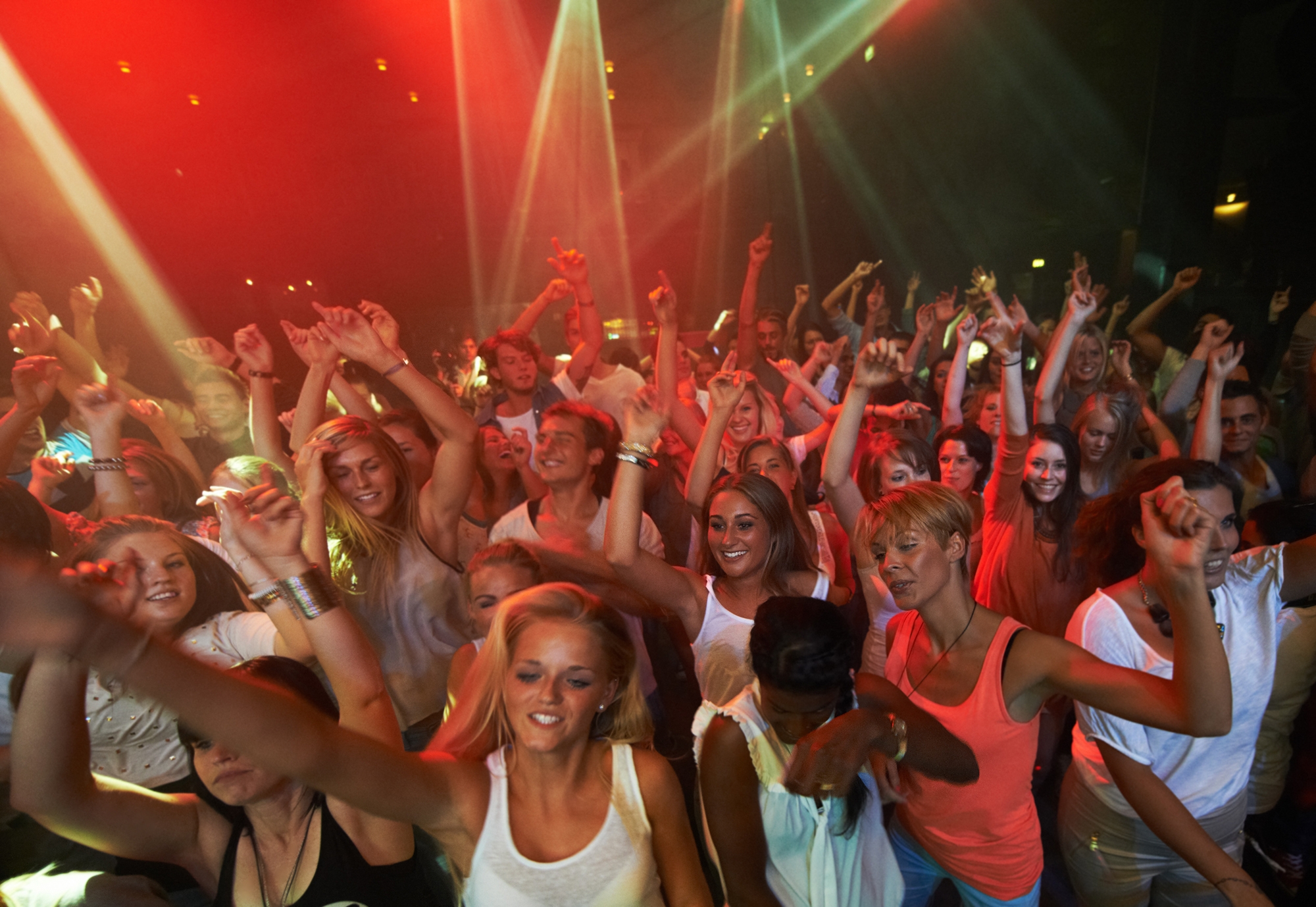 These fans llive to rock. Attractive female fans enjoying a concert- This concert was created for the sole purpose of this photo shoot, featuring 300 models and 3 live bands. All people in this shoot are model released.